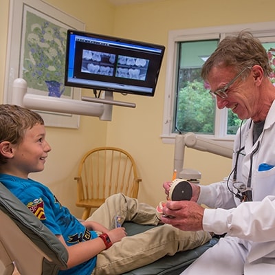 Family Dentistry Hanover, NH - Dr. Wonsavage talking about sealants with a kiddo patient
