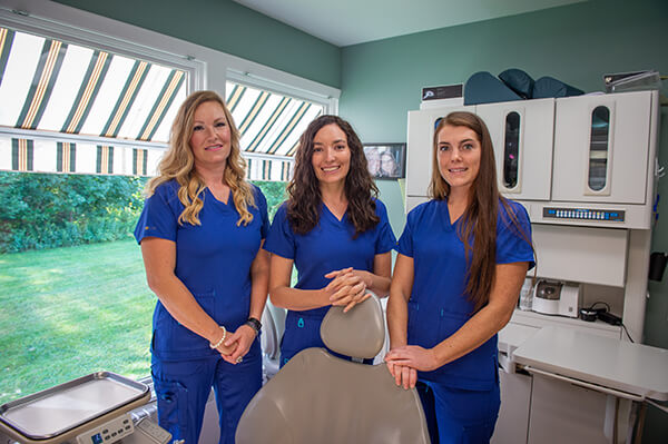 Our Hanover dental assistants smiling together